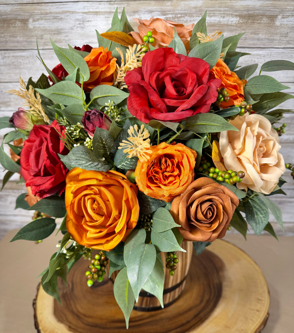 Handmade Floral Arrangement – Red & Orange Roses, Rustic Wooden Barrel