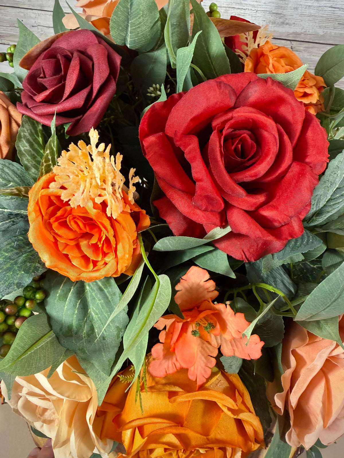 Handmade Floral Arrangement – Red & Orange Roses, Rustic Wooden Barrel