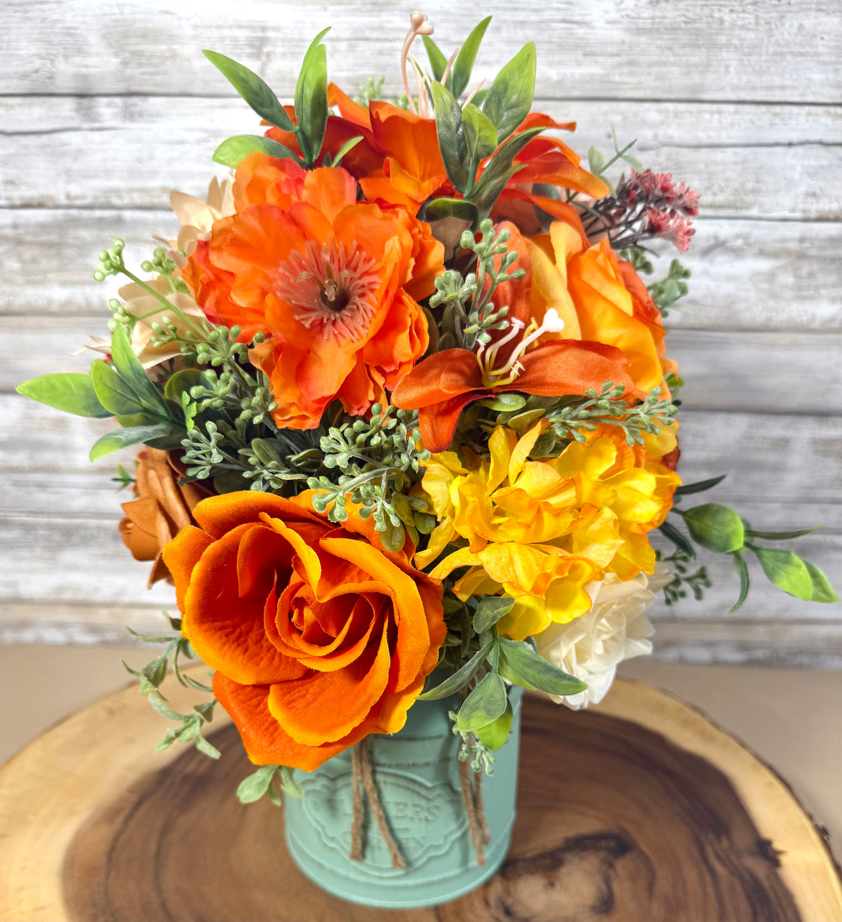 Orange & Yellow Floral Arrangement in Teal Metal Bucket