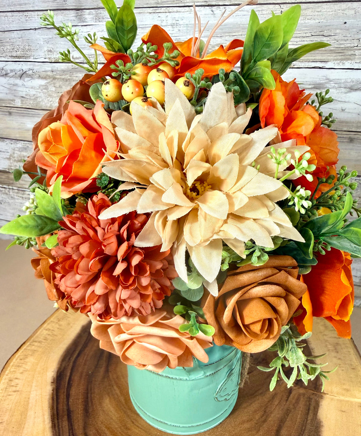 Orange & Yellow Floral Arrangement in Teal Metal Bucket