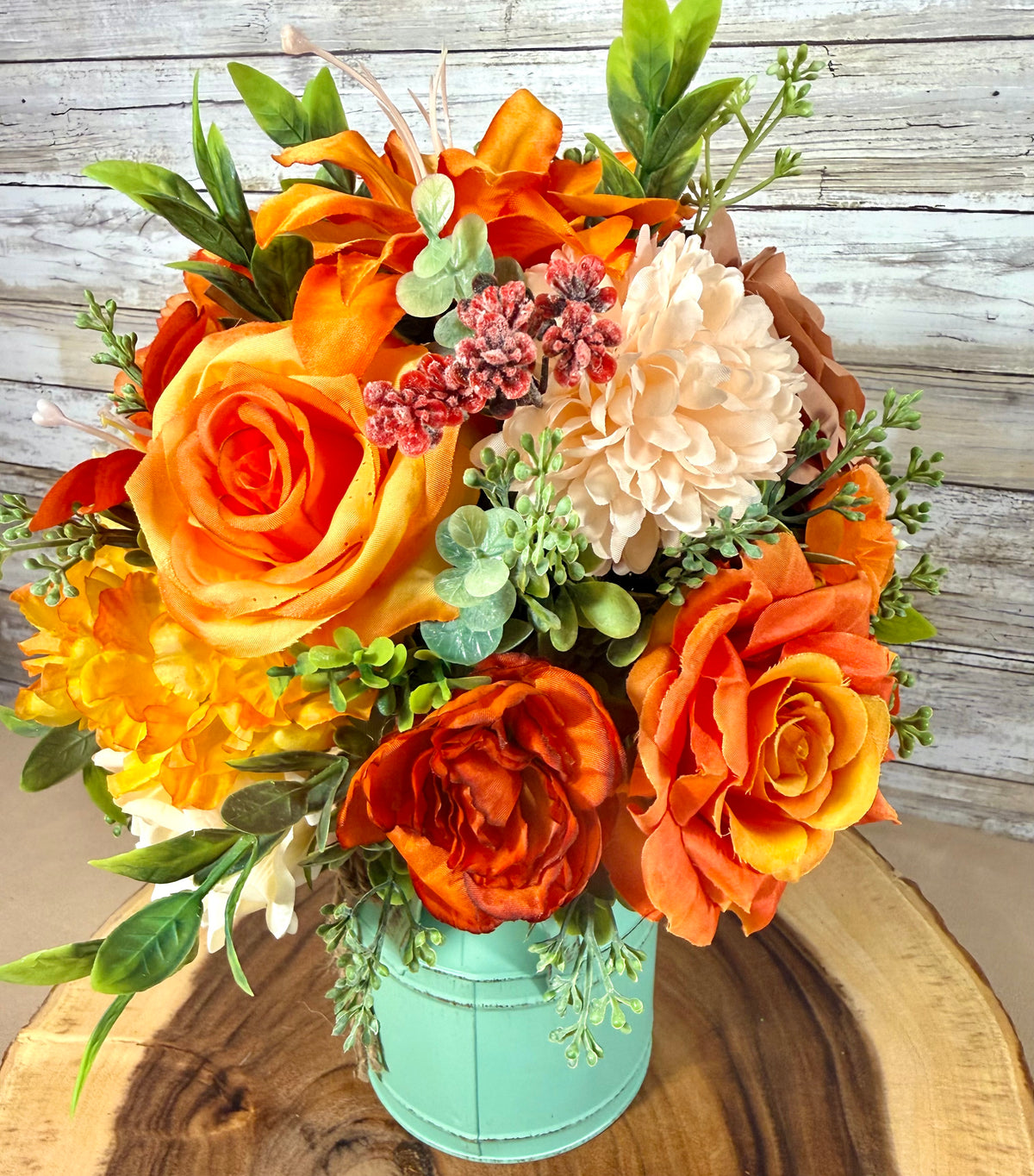 Orange & Yellow Floral Arrangement in Teal Metal Bucket
