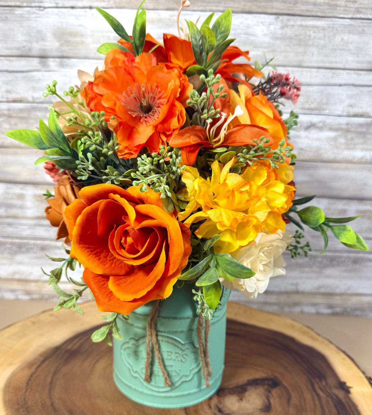 Orange & Yellow Floral Arrangement in Teal Metal Bucket